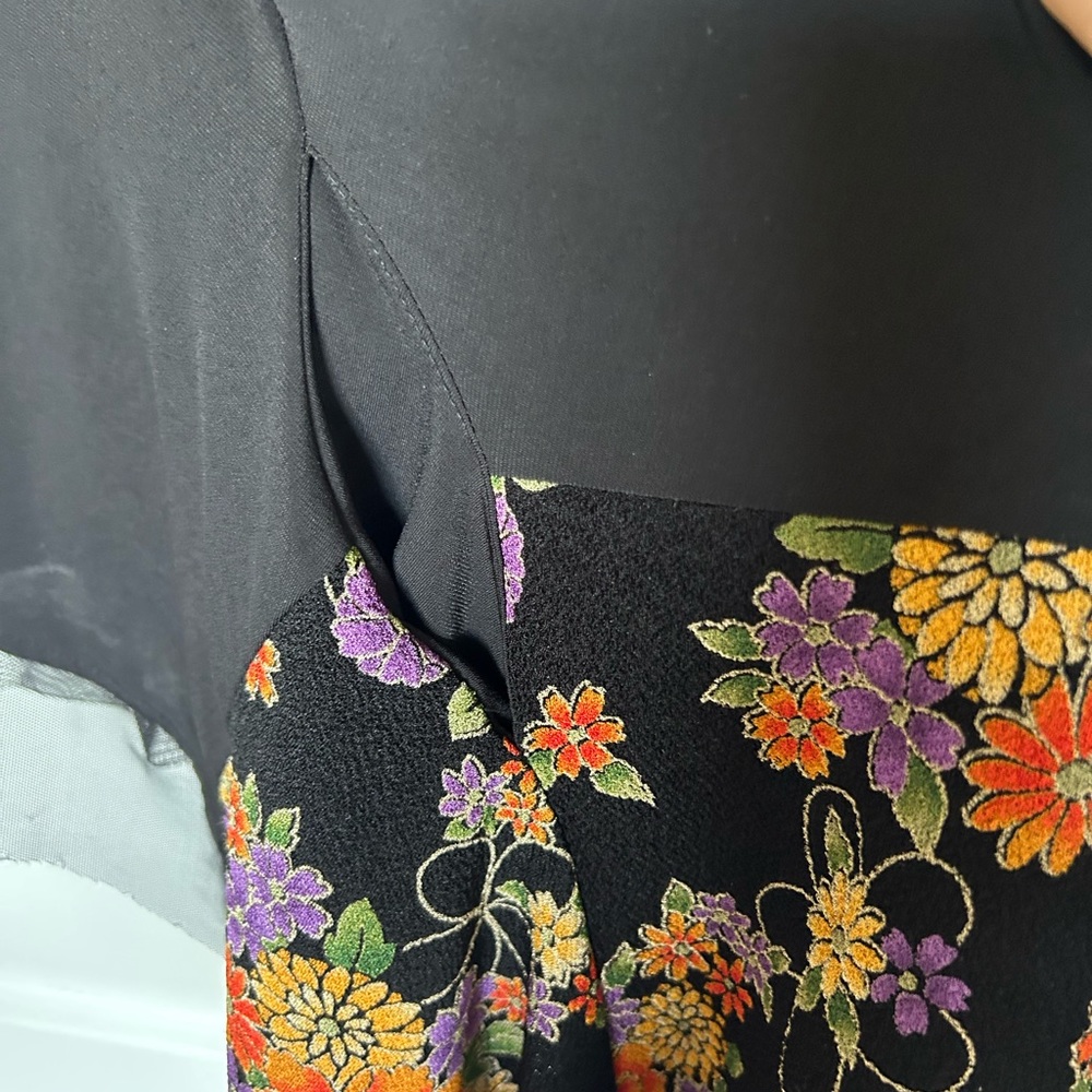 Black top with floral trim. - Picture 5 of 9